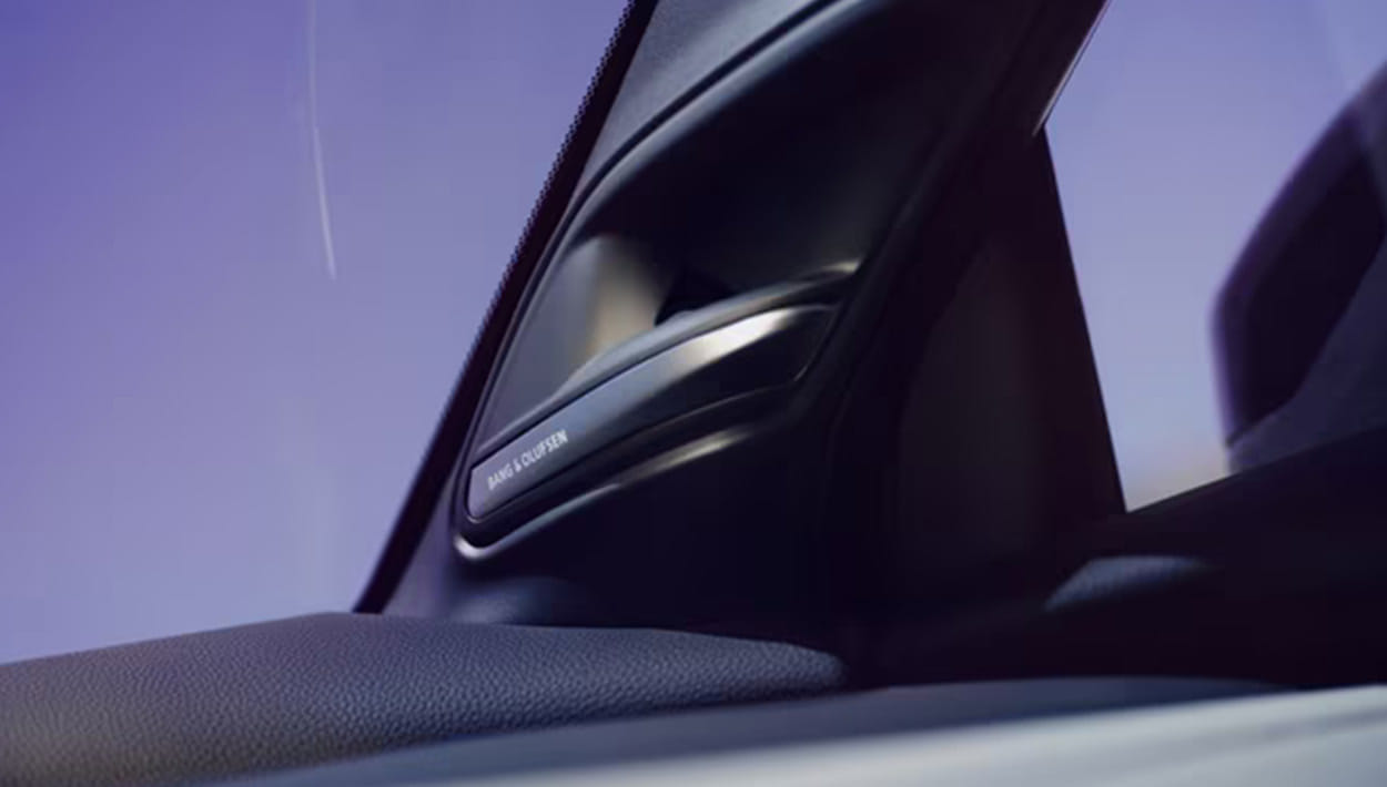 Interior view of a car with a clear blue sky visible through the windshield.