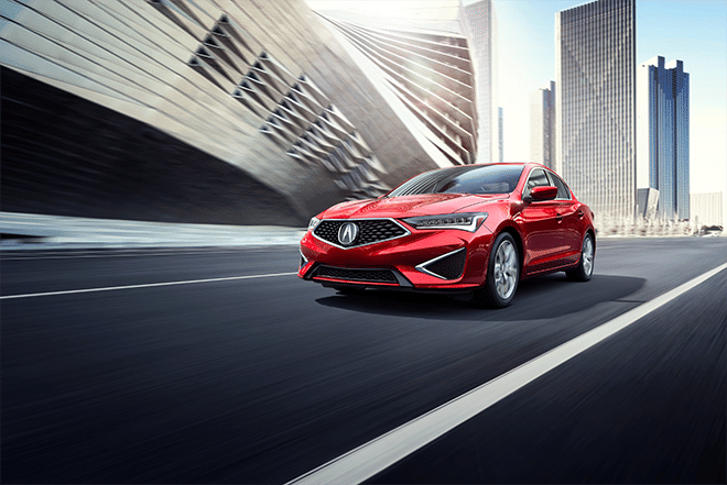 Acura car is driving through the city