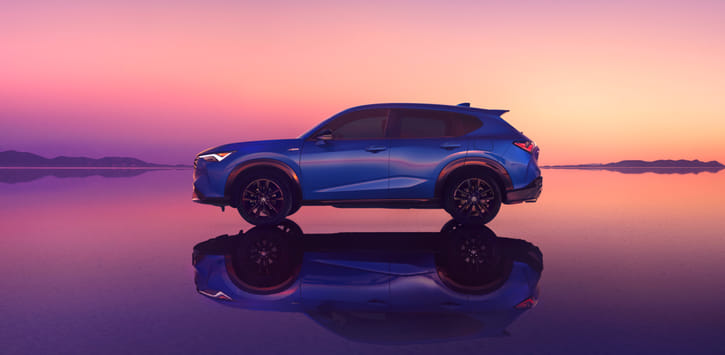 Side profile of a blue 2025 ADX A-Spec on the purple background.