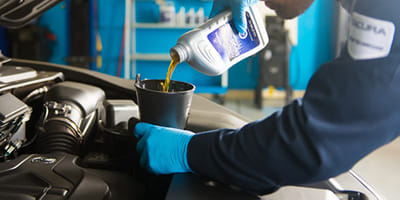 Mechanic working on oil change