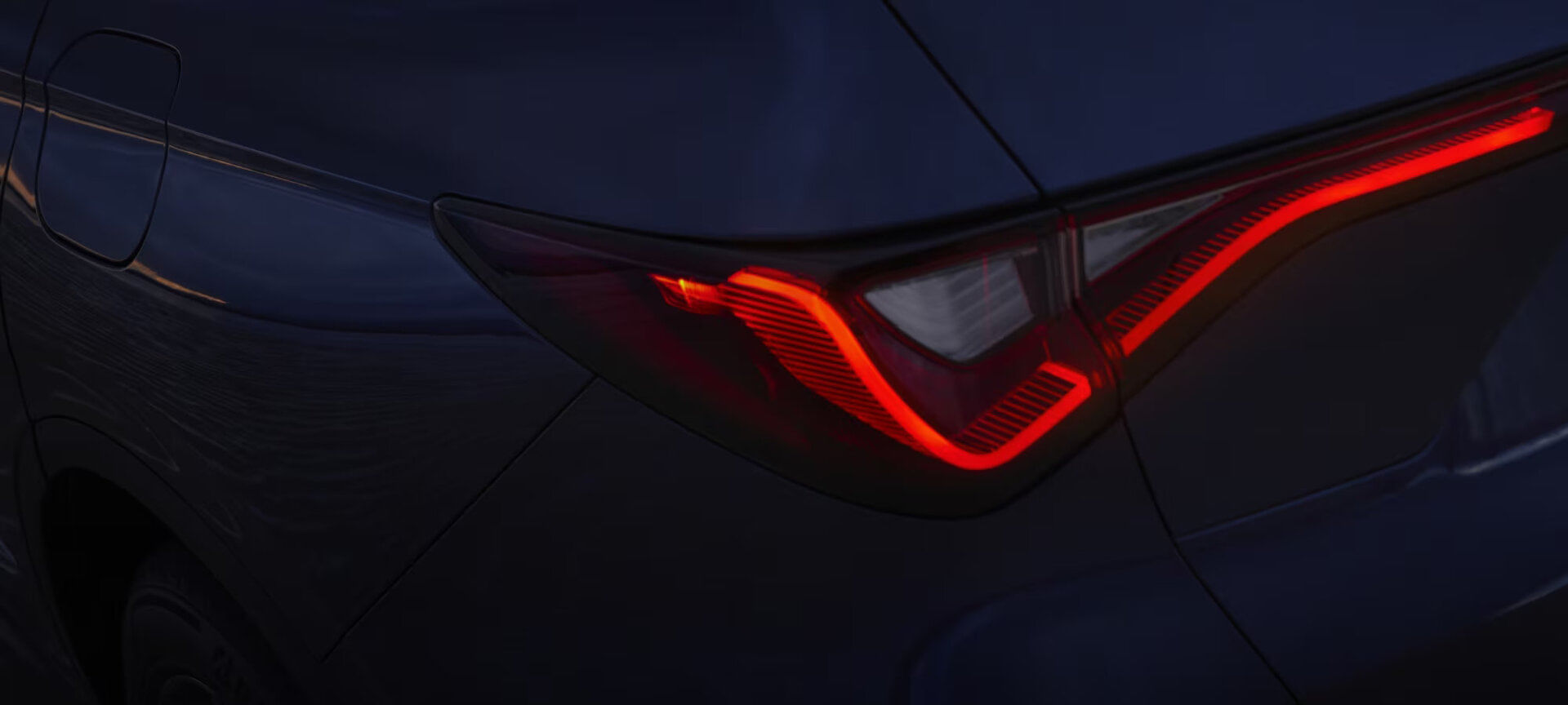 Exterior back view of a 2025 Acura MDX, showcasing its redesigned front fascia and Jewel Eye® LED headlights.
