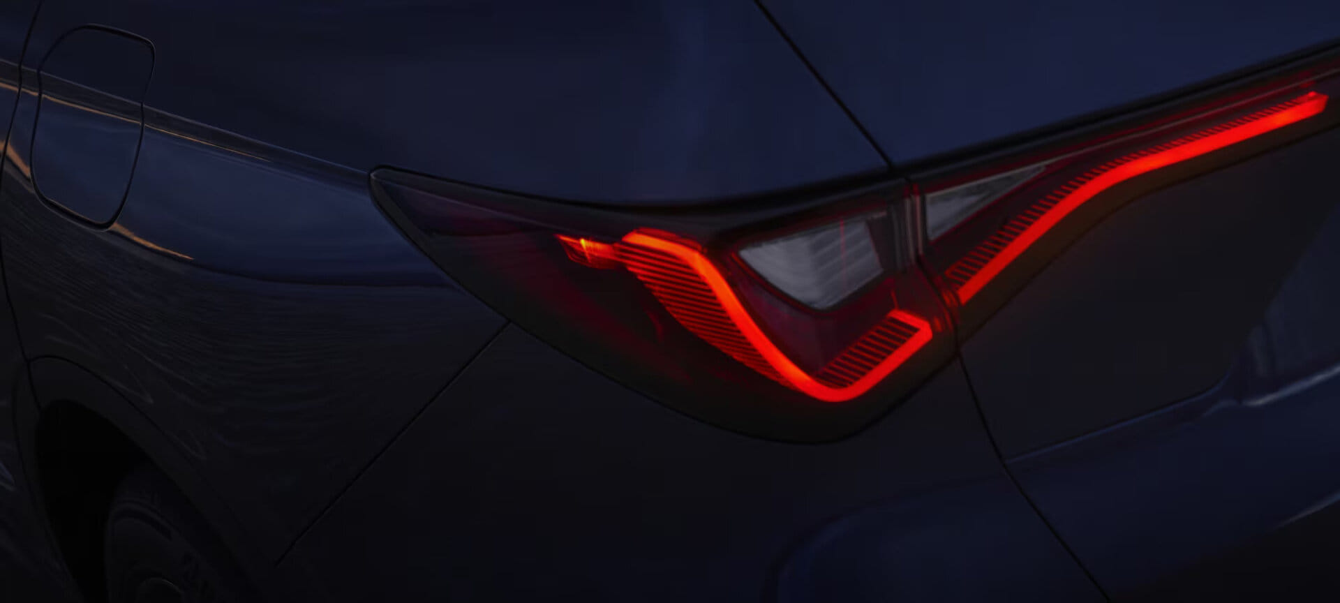 Exterior back view of a 2025 Acura MDX, showcasing its redesigned front fascia and Jewel Eye® LED headlights.