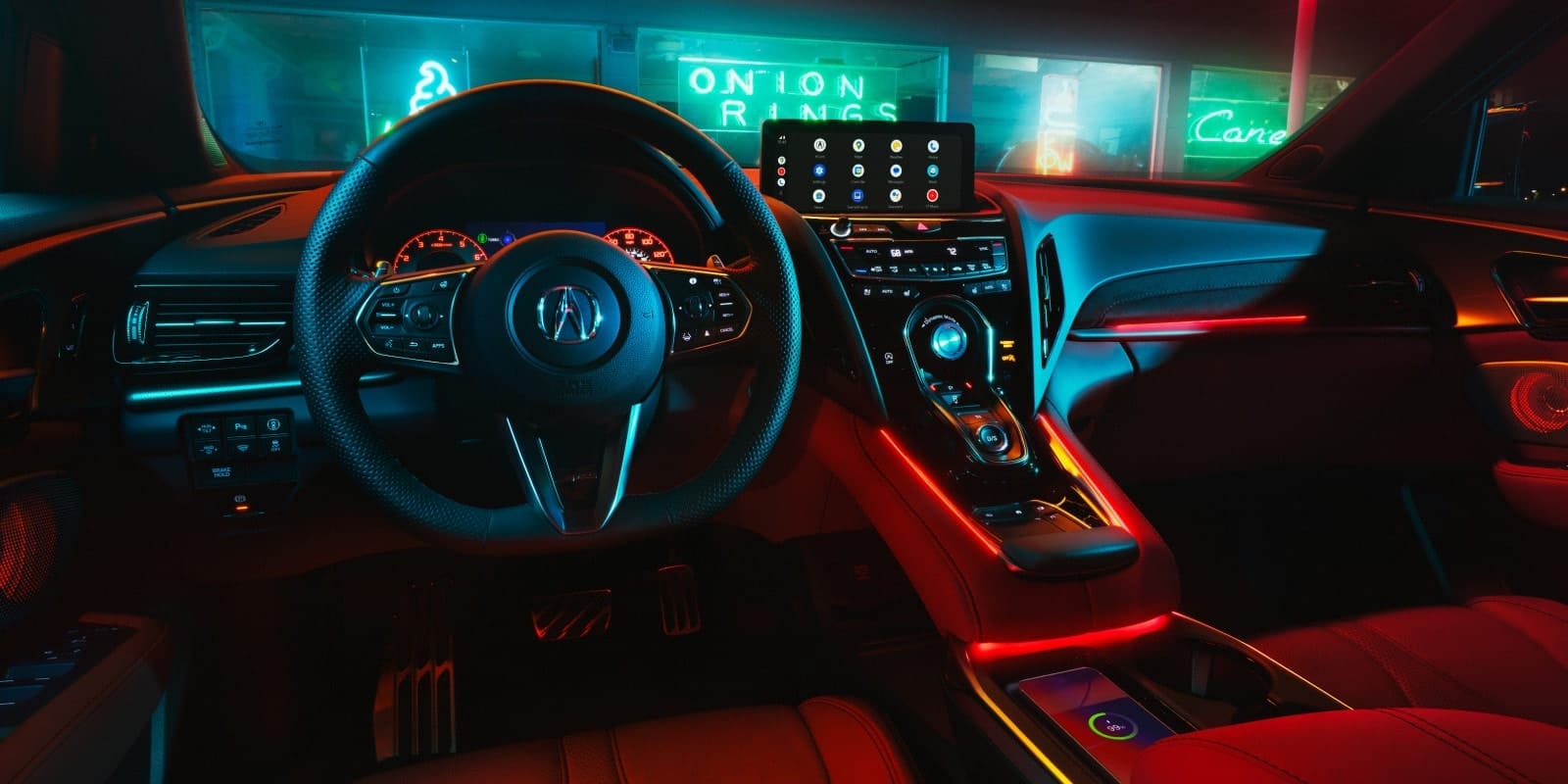 Interior view of the 2026 Acura RDX showing the redesigned center console, updated textures, and premium seating.