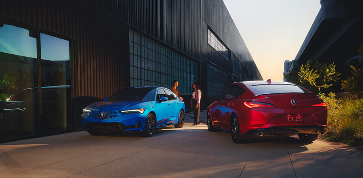 Two 2026 Integras—one front view, one rear view—with two people talking between them.