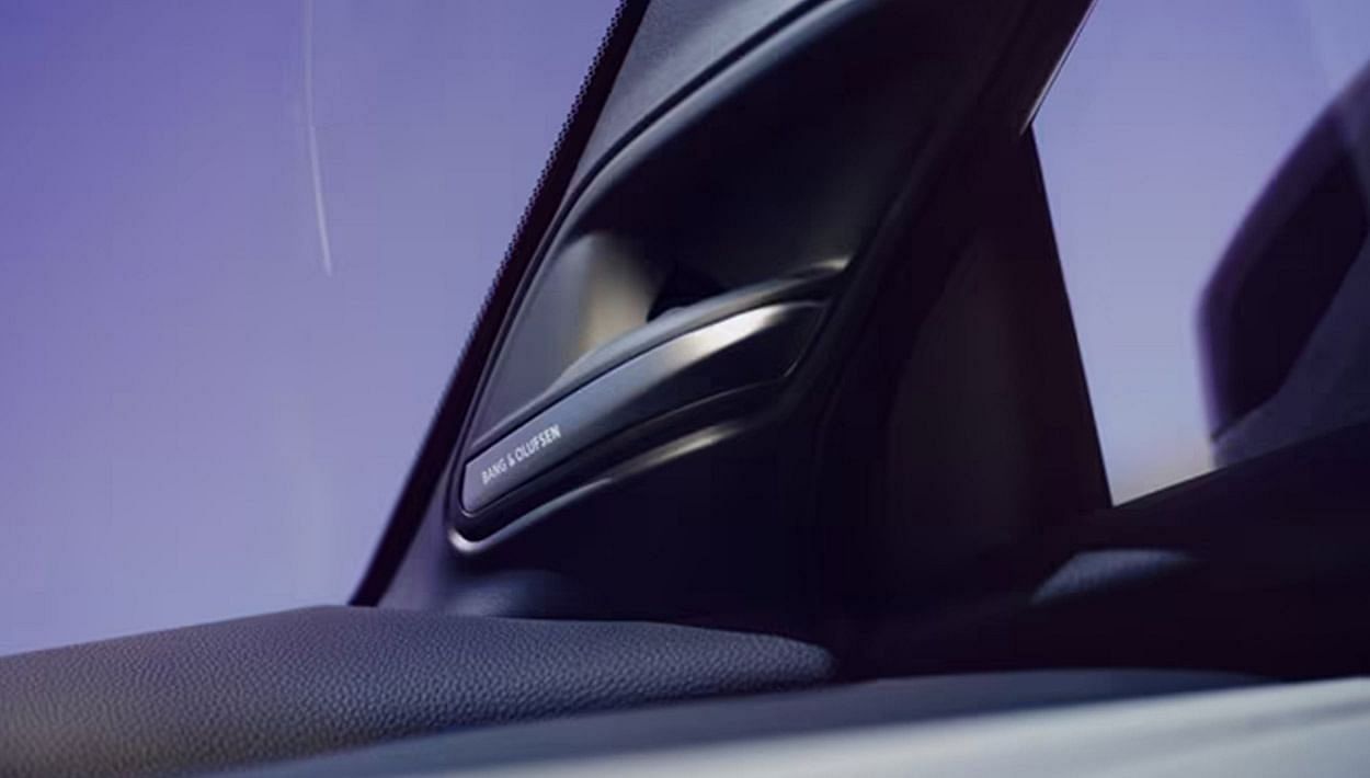 Interior view of a car with a clear blue sky visible through the windshield.