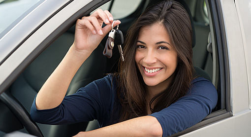 Woman holding car keys