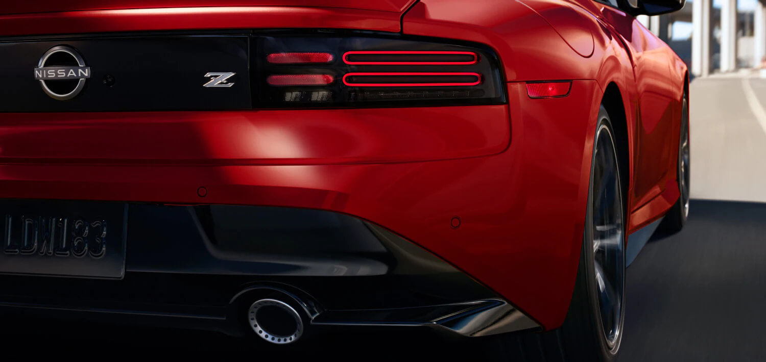 The 2026 Nissan Z showcasing its sculpted body and aerodynamic design, paying homage to its heritage.