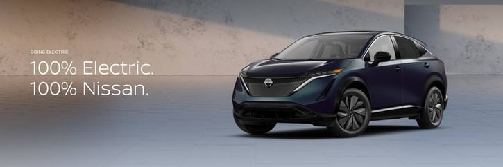 A modern Nissan electric SUV is showcased in a minimalist setting, highlighting "100% Electric. 100% Nissan." text.