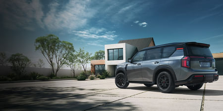 2025 Armada parked in a driveway in front of a house.