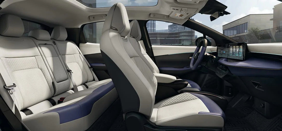 Wide view of the 2026 Nissan Leaf's premium, lounge-like interior, featuring Zero Gravity Seats and high-quality materials.