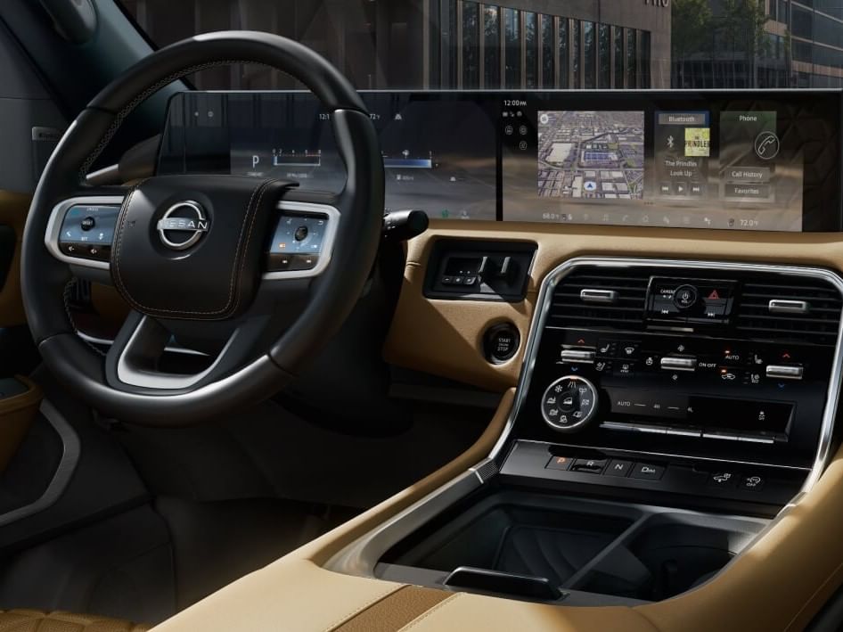 Interior view of a 2026 Nissan Armada featuring a sleek dashboard, advanced touchscreen, and a stylish steering wheel.