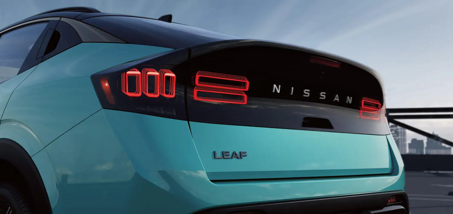 Detailed view of the 2026 Nissan Leaf's rear tail lights, featuring an available 3D holographic design.