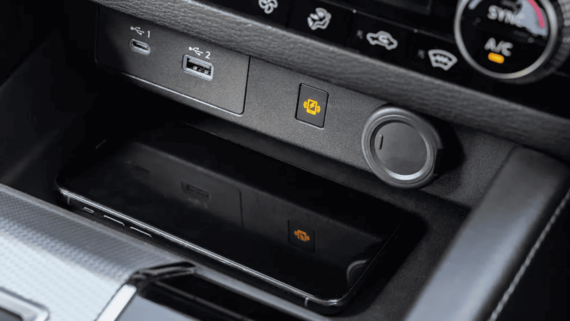 2024 Mitsubishi Outlander interior console with USB ports and wireless charging pad