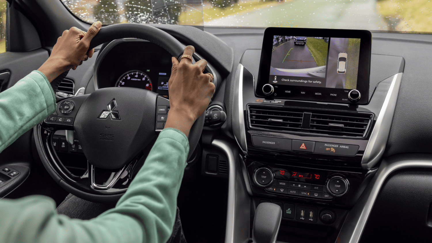 Close-up view of the 2025 Mitsubishi Eclipse Cross interior showing the steering wheel and rearview camera display, ideal for Lakeland drivers.