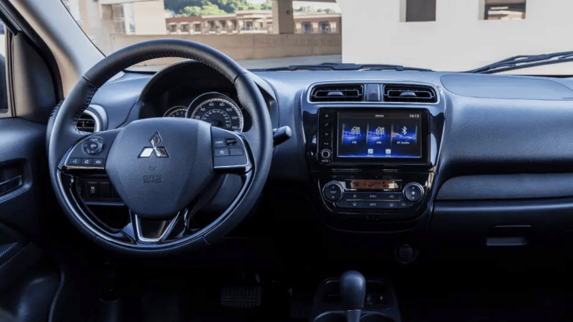 Interior dashboard and steering wheel of 2024 Mitsubishi Mirage G4 near Brandon, FL