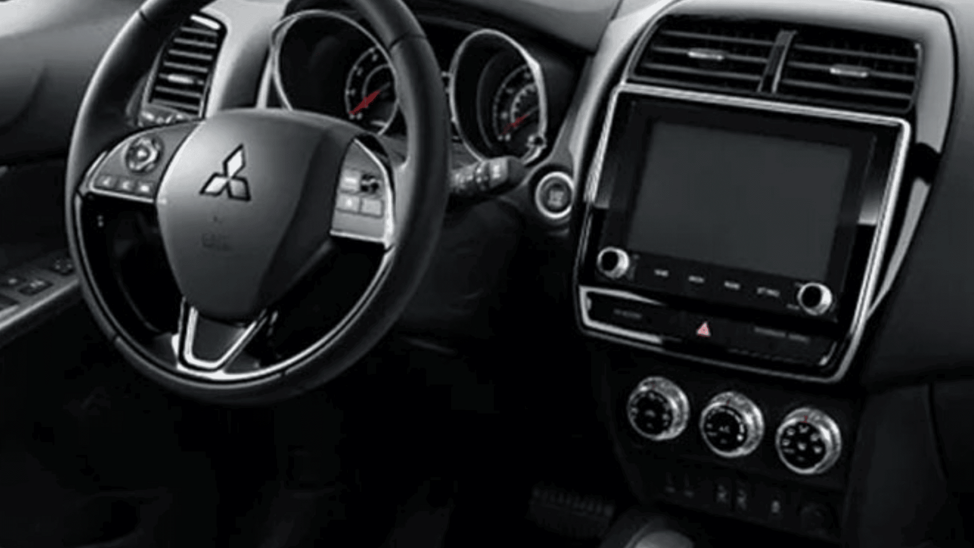 Interior dashboard of 2025 Mitsubishi Outlander Sport showcasing touchscreen and climate controls near Brandon, FL