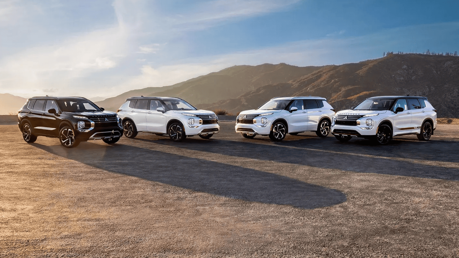 A lineup of 2025 Mitsubishi Outlander models in various colors on display near Lakeland, FL.