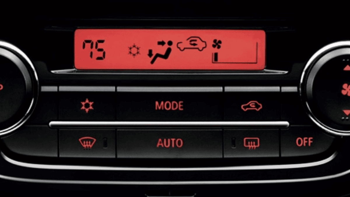 Close-up of the 2024 Mitsubishi Mirage climate control panel with red LED display, photographed near Tampa, FL to showcase intuitive HVAC features.