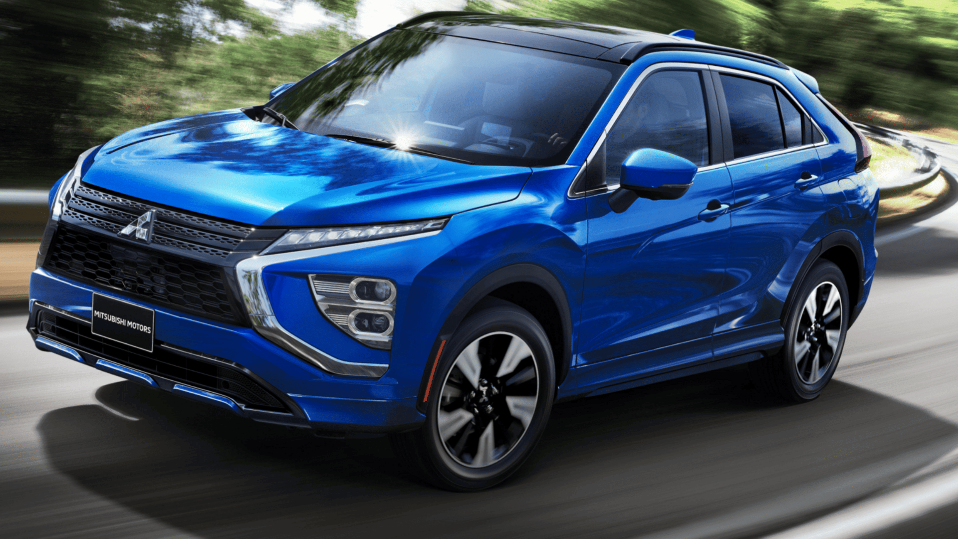 Dynamic front driving shot of blue 2025 Mitsubishi Eclipse Cross SUV in Brandon, FL
