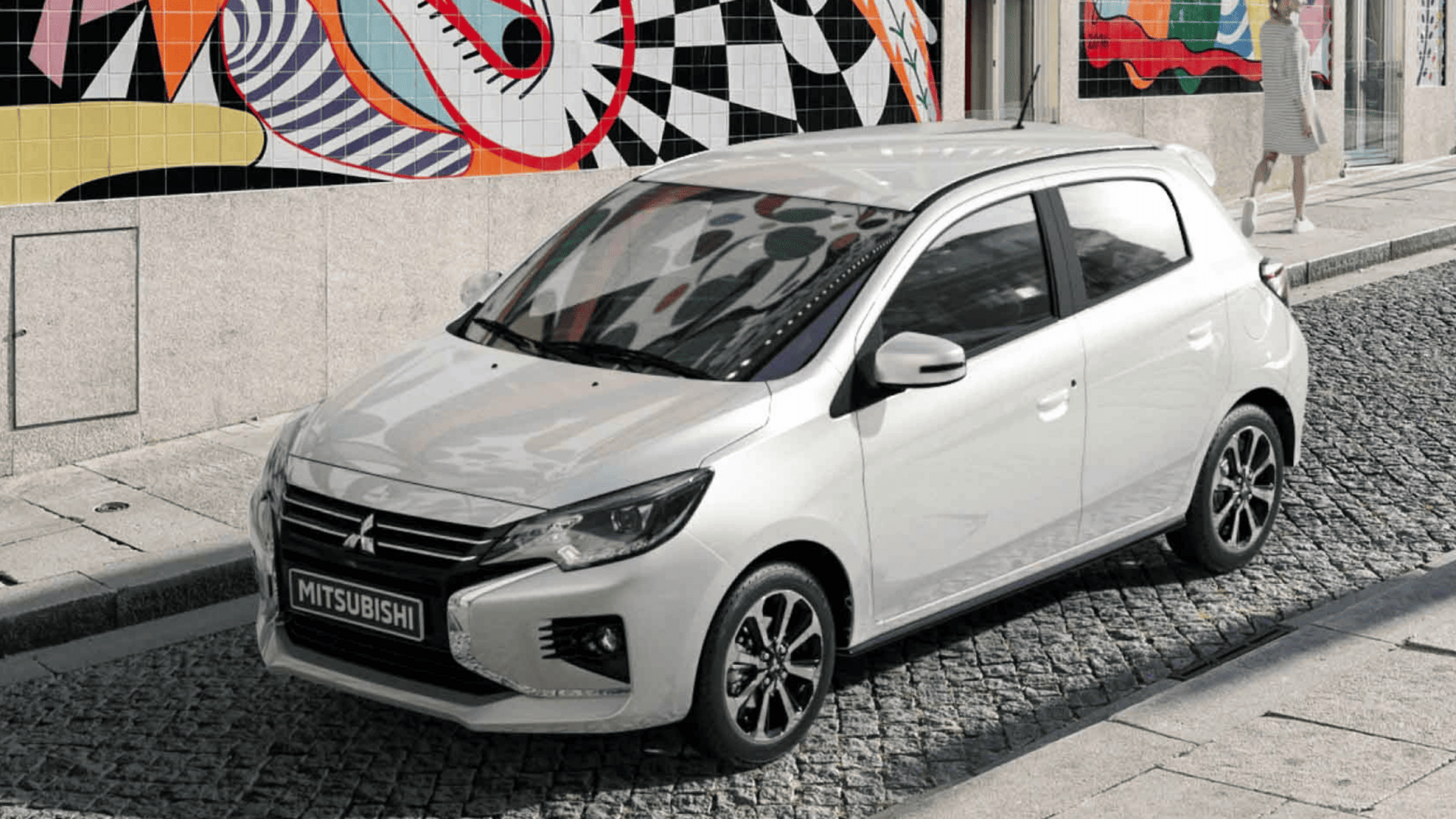 2024 Mitsubishi Mirage parked near mural wall on cobblestone street in Brandon, FL