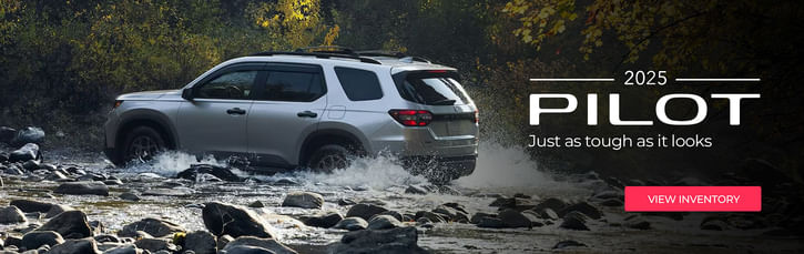 2025 Pilot driving through rough terrain