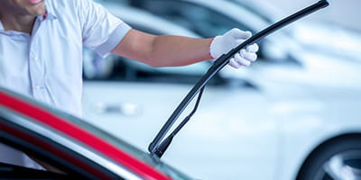 Mechanic working on windshield wipers