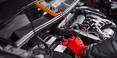 Mechanic Checking Battery