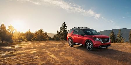 2023 Pathfinder red standing on a hill