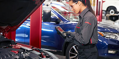 Mechanic inspecting a car