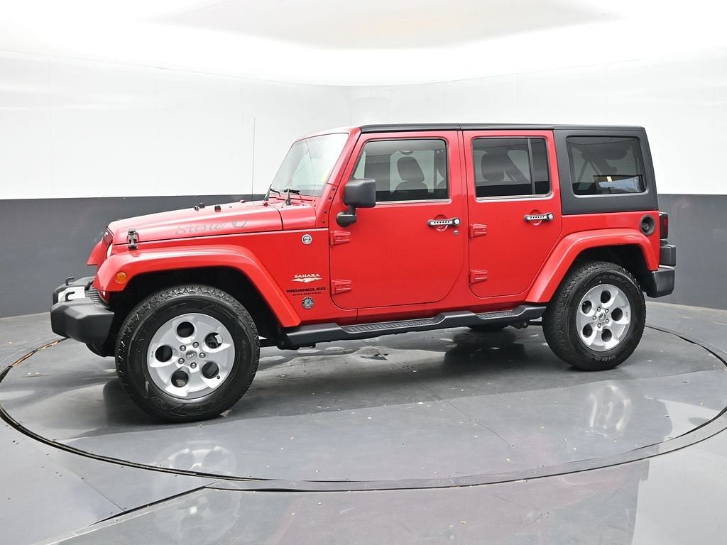 Used 2013 Jeep Wrangler Unlimited Sahara with VIN 1C4BJWEG1DL704405 for sale in Daphne, AL