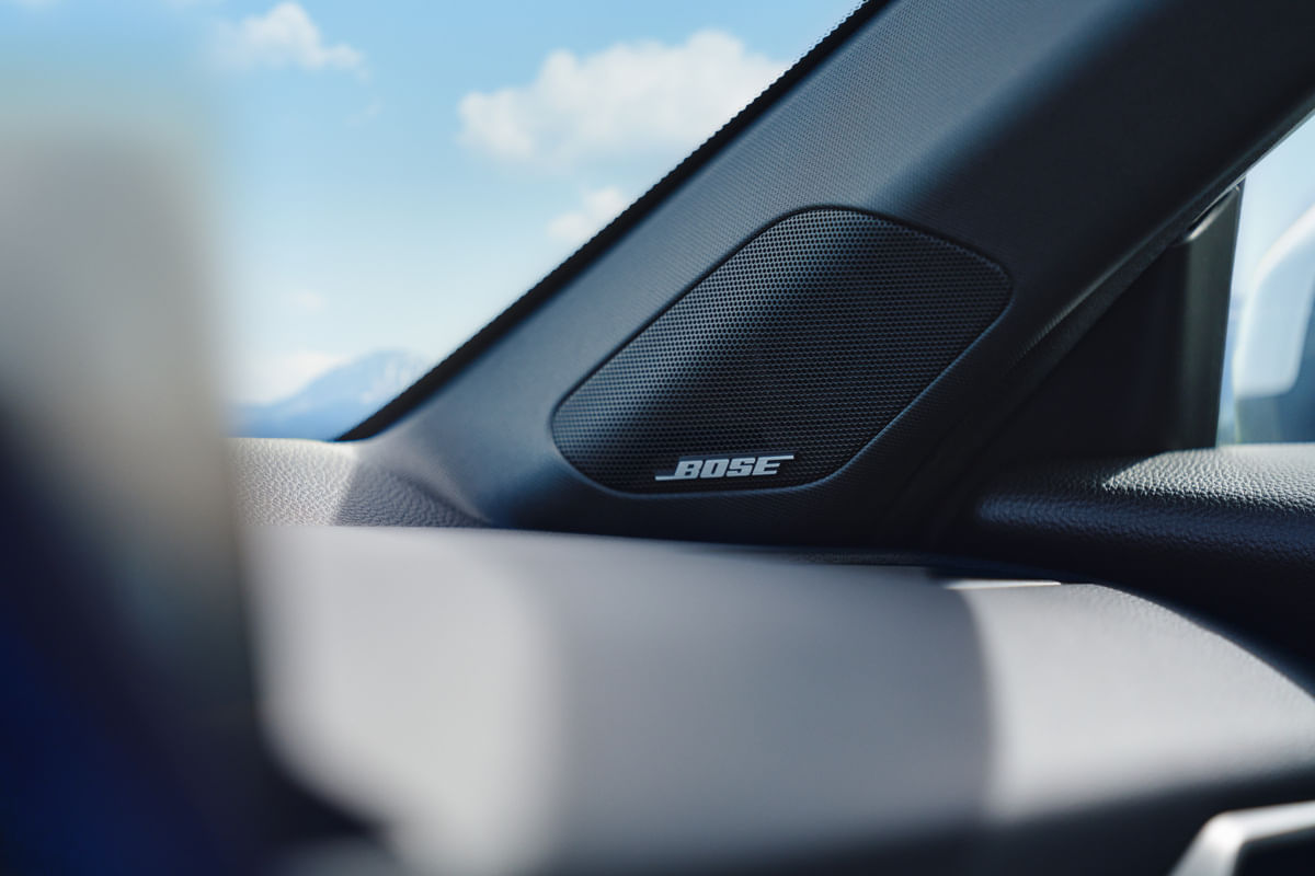 A close-up detail shot of the Bose premium sound system speaker, with the BOSE logo, integrated into the A-pillar of the 2026 Honda Prelude.