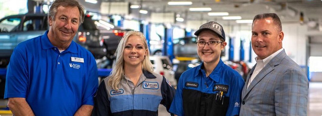 Staff from Ed Voyles Honda standing in the Honda Service Center