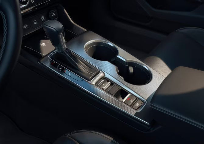 Close-up of the 2025 Honda Civic Hybrid's 4-Mode Drive System selector and elegant center console design.