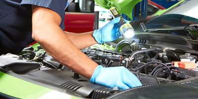 Mechanic checking the car