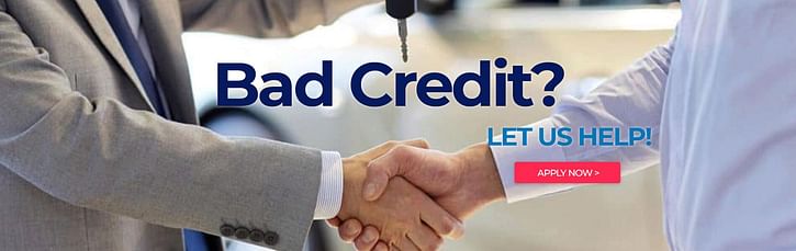 Men shaking hands, "bad credit" sign in the middle