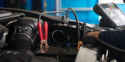 Mechanic Checking Battery