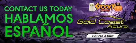 Halloween-themed Gold Coast Acura ad with a purple haunted landscape, ghost and pumpkin logo, and bold green text: “Contact us today, hablamos español.”