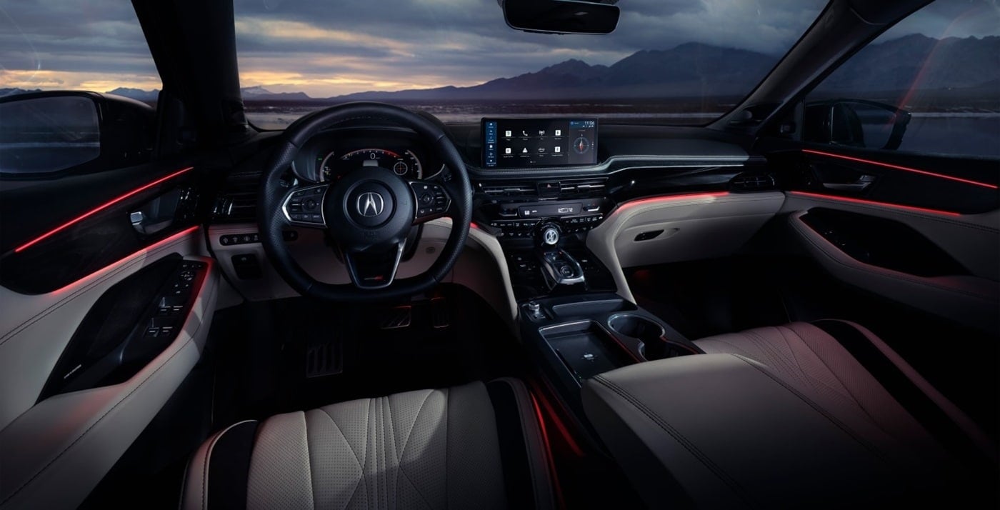 Sleek 2026 Acura MDX interior with modern design, featuring a stylish steering wheel, glowing ambient lighting, and a high-tech dashboard display.