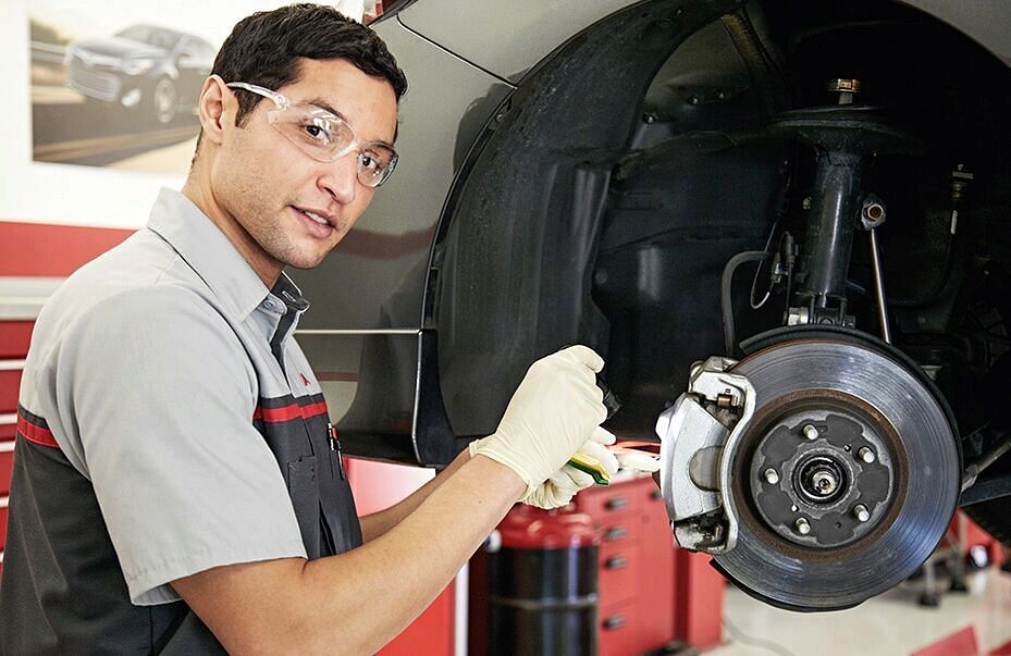 Man checking tire brakes