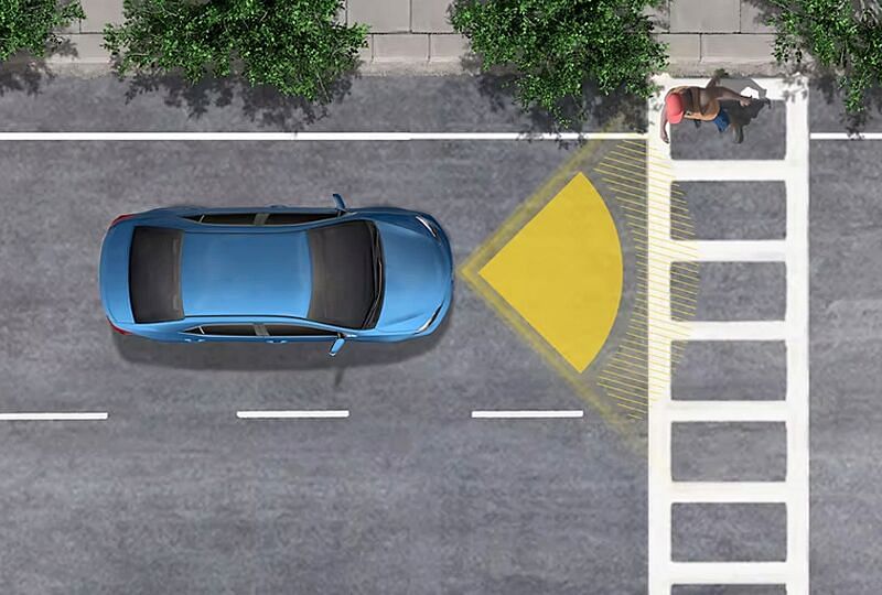 A car is in the driver's blind spot and the safety technology is notifying him