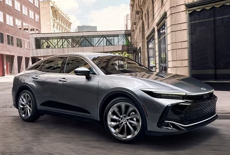 A Toyota parked on a city street, showcasing its sleek design against an urban backdrop.