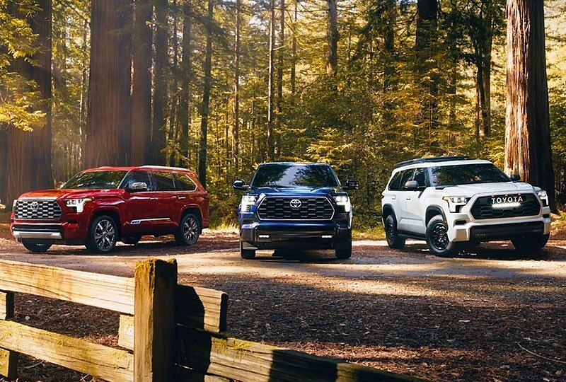 3 2023 Toyota Sequoias parked in the outdoors