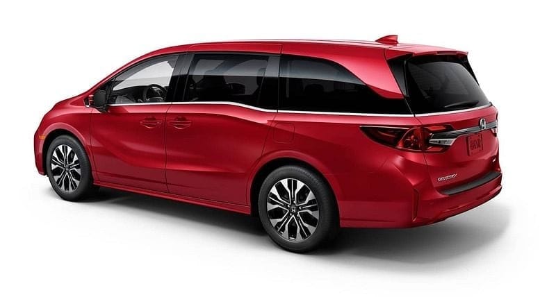 The 2026 Honda Odyssey Elite In Radiant Red Metallic II 3/4 rear view