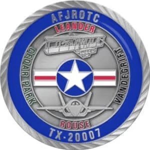 A round AFJROTC emblem featuring a blue border, white star with red stripes, and airplane symbol. Words include “Leander” and “Vandegrift.”