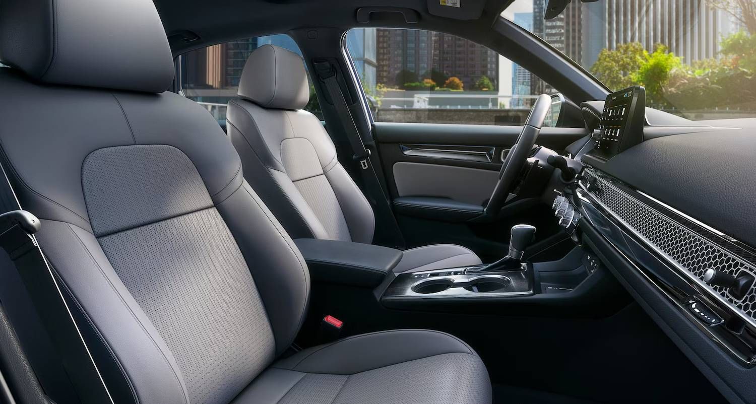 The 2025 Honda Civic Sedan Sport Touring Hybrid in Blue Lagoon Pearl, Grey Interior showing heated seats