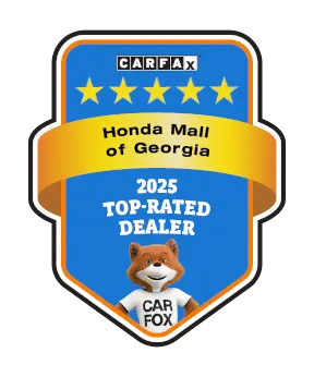 Blue shield-shaped badge with 'CARFAX' header, five gold stars, 'Honda Mall of Georgia,' '2025 Top-Rated Dealer,' and a fox mascot in a 'CAR FOX' shirt.