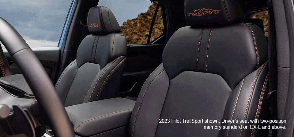 2023 Honda Pilot TrailSport shown. Driver's leather seat with two-position memory standard on EX-L and above.