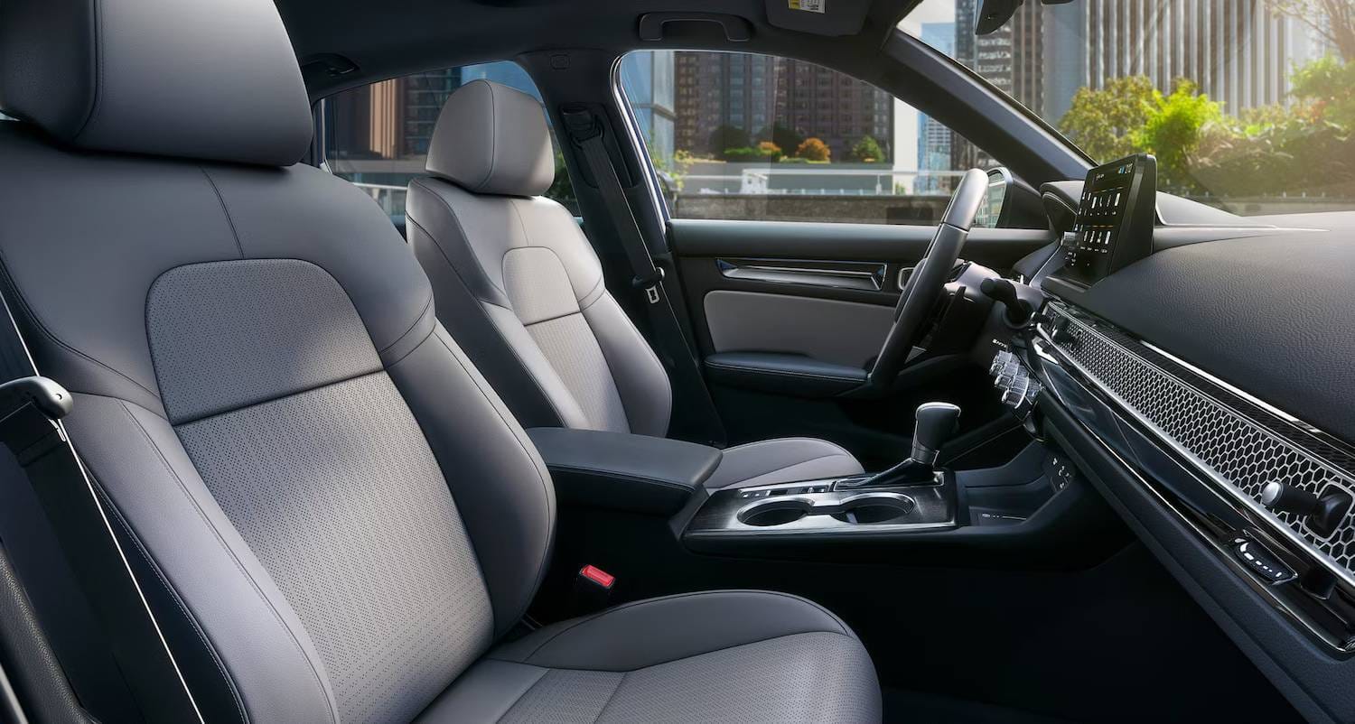 The 2025 Honda Civic Sedan Sport Touring Hybrid in Blue Lagoon Pearl, Grey Interior showing heated seats
