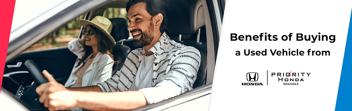 Two happy people inside a car with text on the right The benefits of buying used cars from Honda & Priority Honda Roanoke