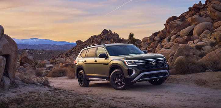 A green 2026 Atlas parked in a desert setting.